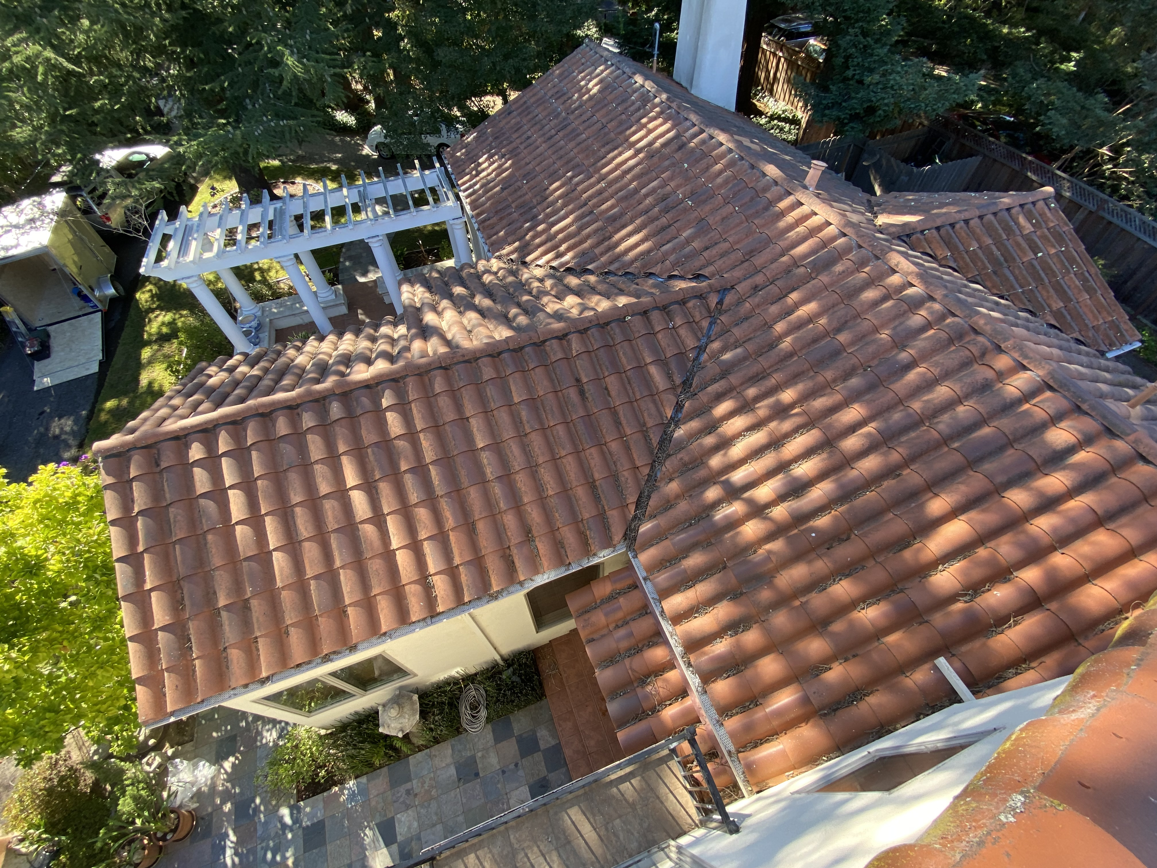 Before — Atherton tile roof with lichen on shaded sections before treatment