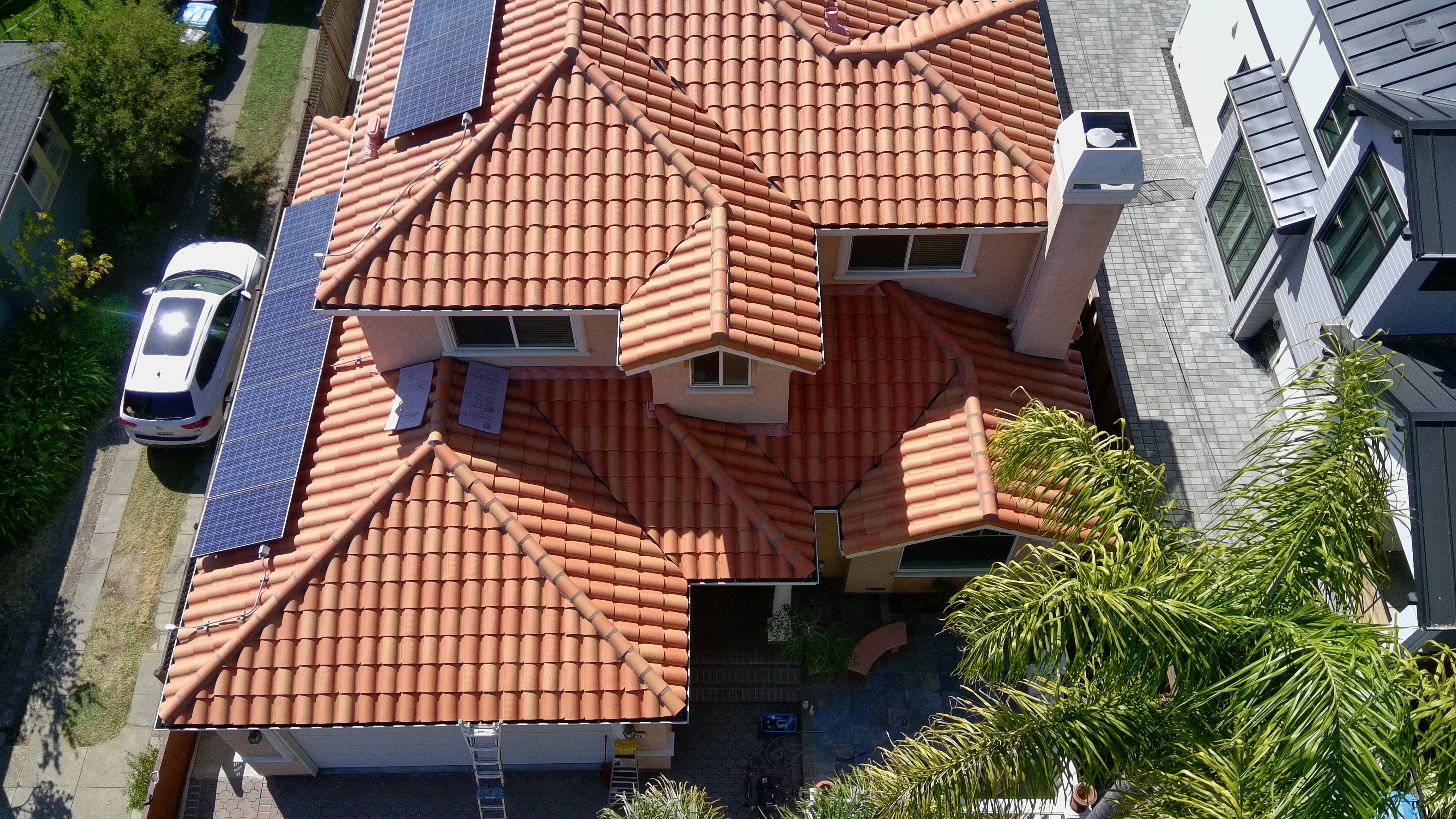 After — Burlingame Spanish tile roof fully cleaned, wide view after soft wash