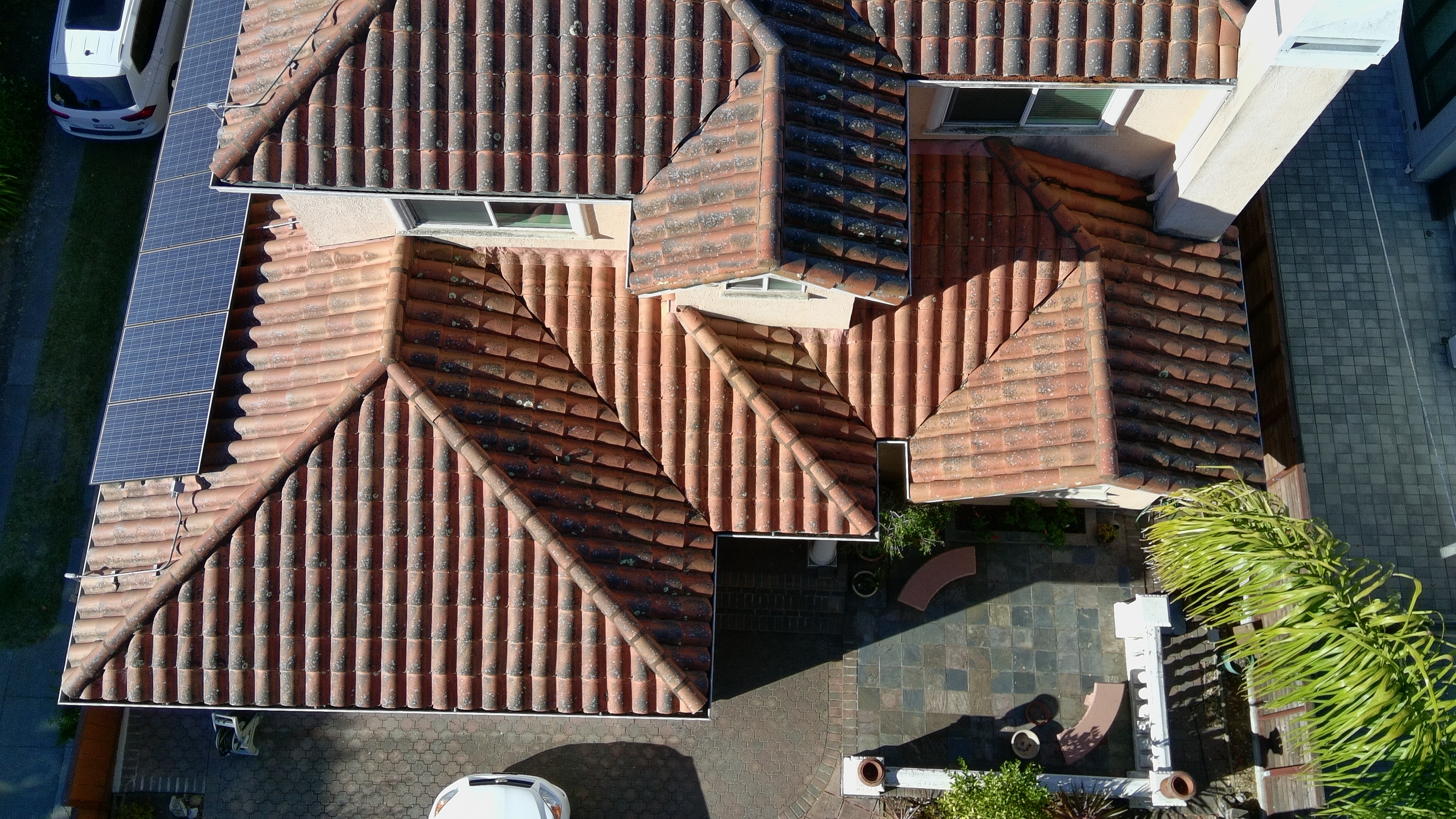 Before — Burlingame Spanish terracotta tile roof with heavy moss and lichen growth
