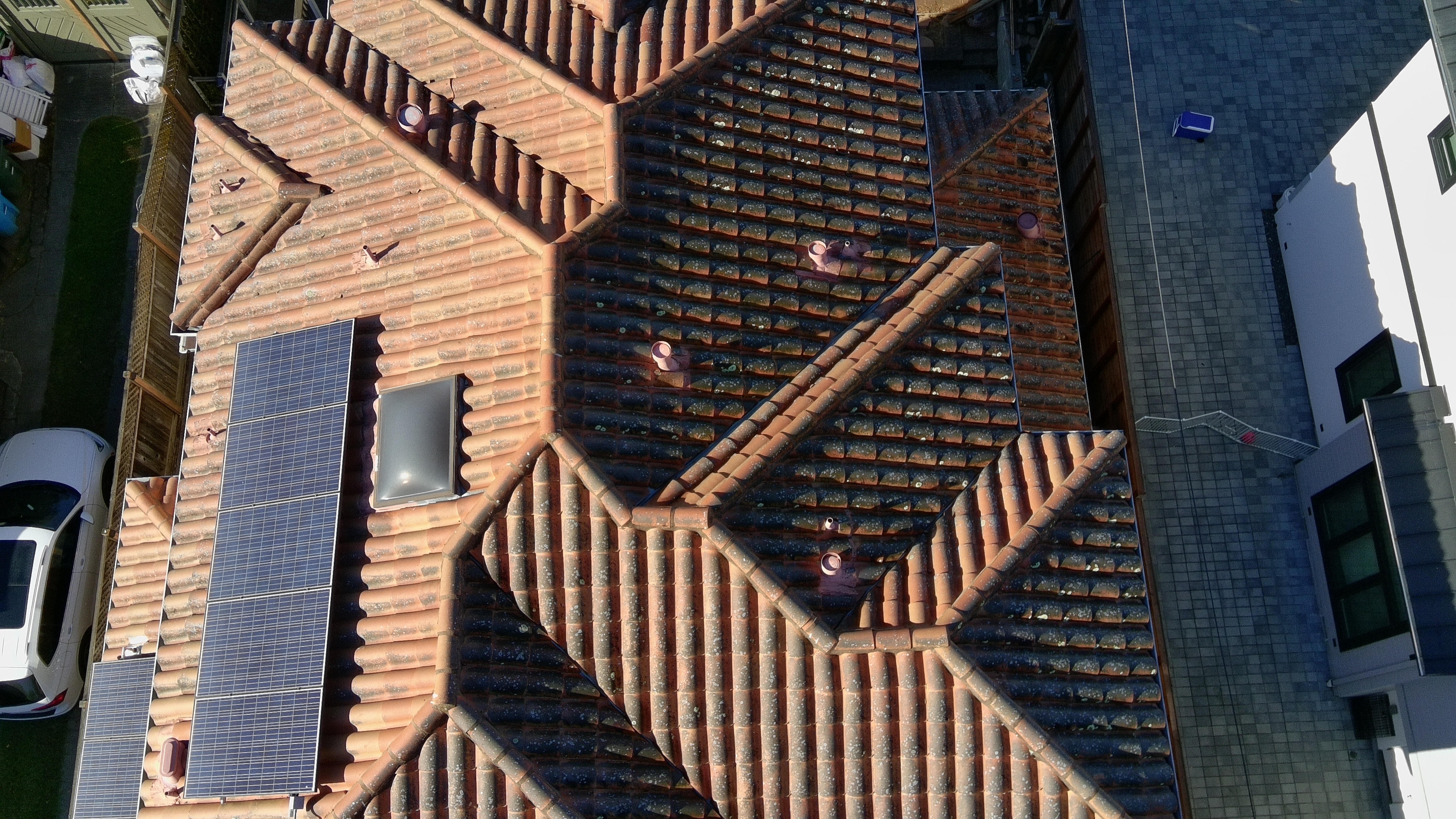 Before — Burlingame terracotta tile roof section with moss colonization