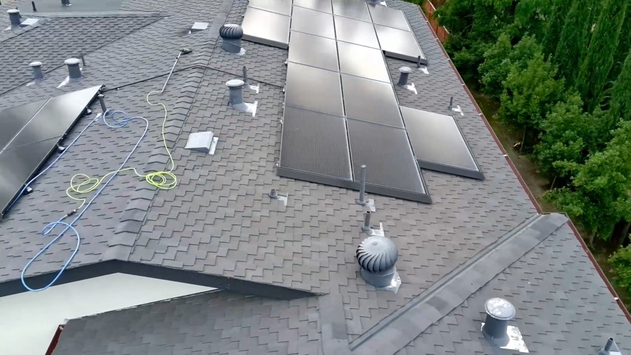 Solar panels soiled with dust and bird droppings on a Cupertino, California rooftop before cleaning