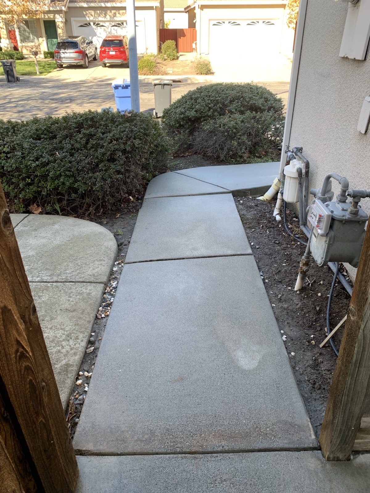 After — Fremont side walkway cleaned to a uniform finish, looking out toward the street