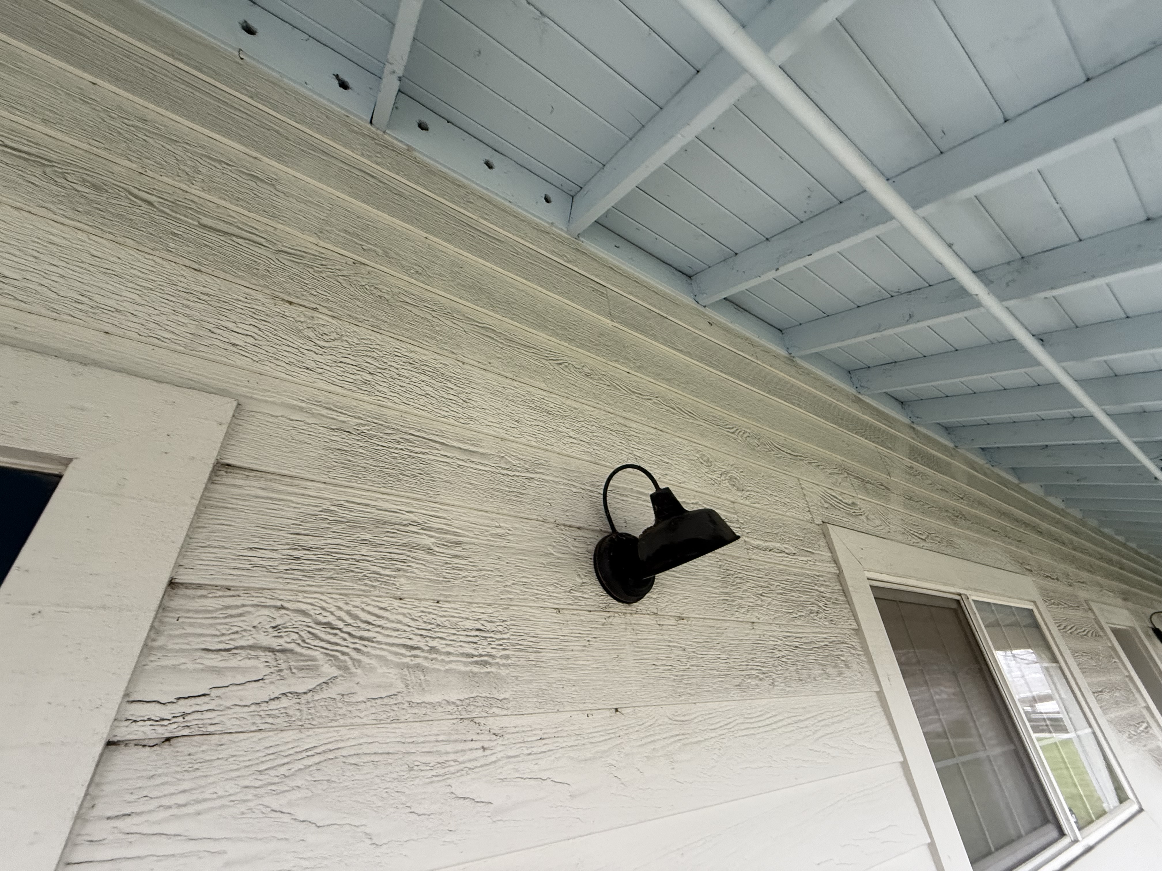 Before — Fremont metal roof panel faces with dark pollution film