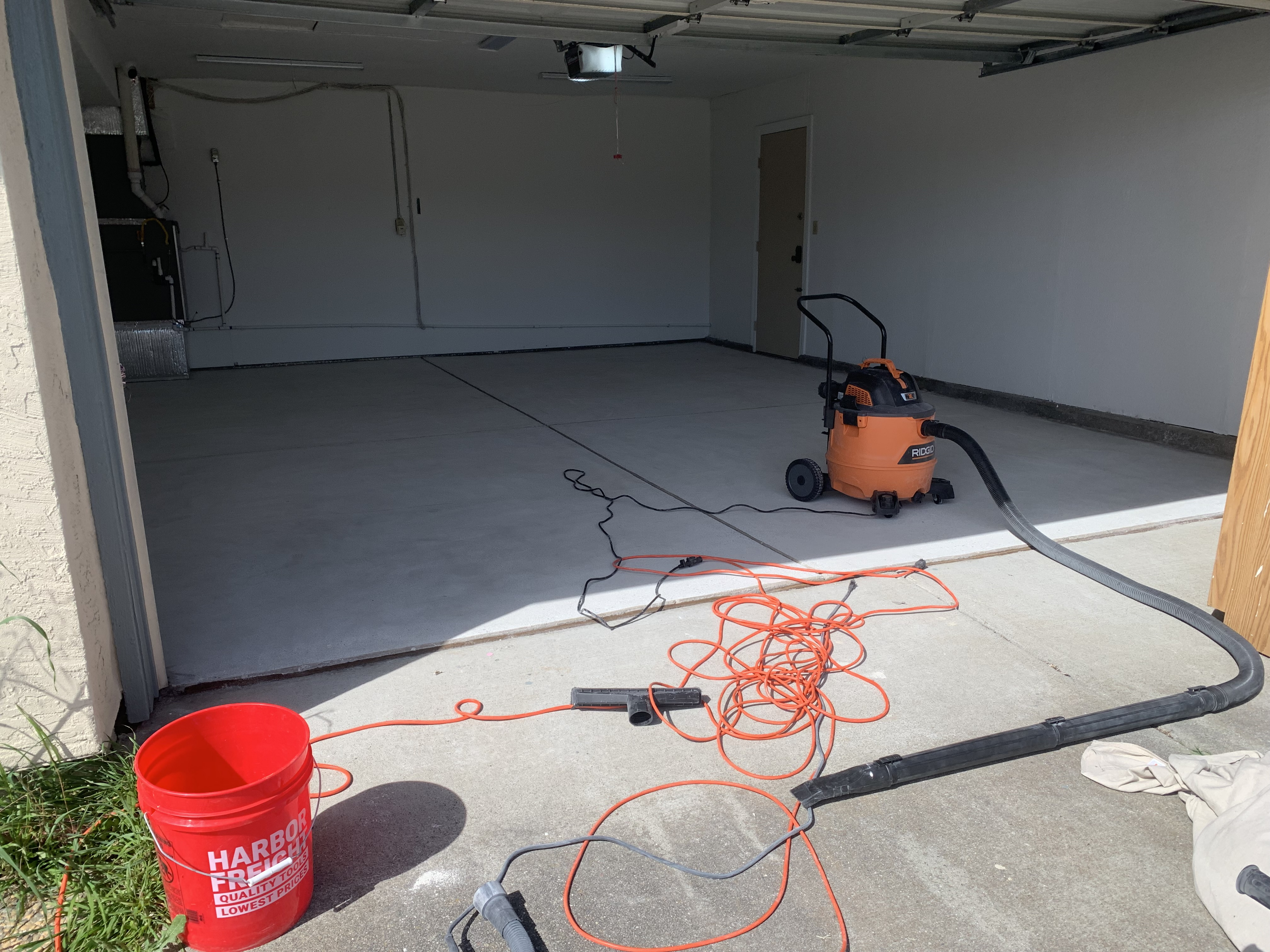 Before — Fremont garage floor bare concrete with oil stains before epoxy