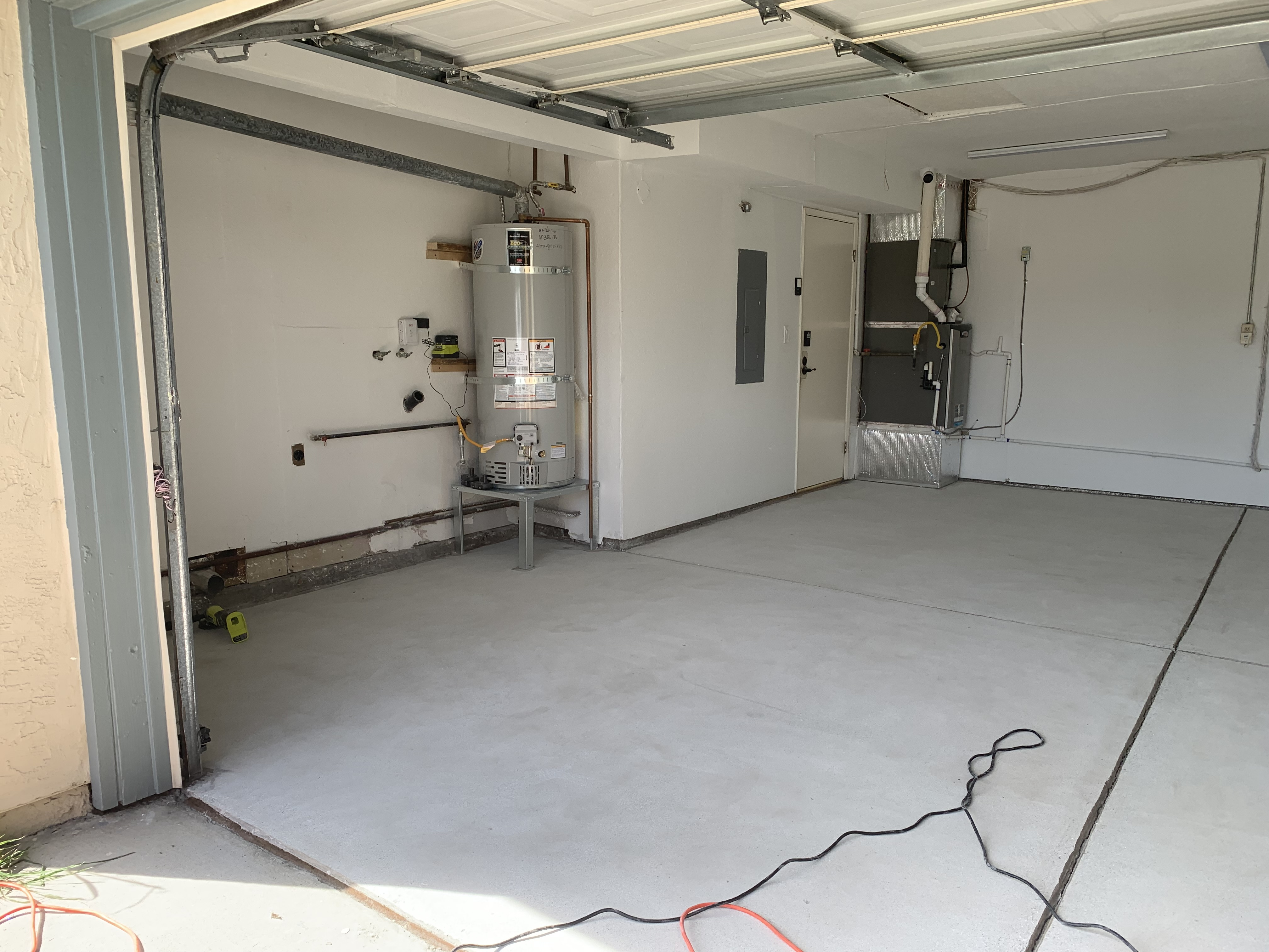 Before — Fremont concrete floor stained and worn before solid color epoxy