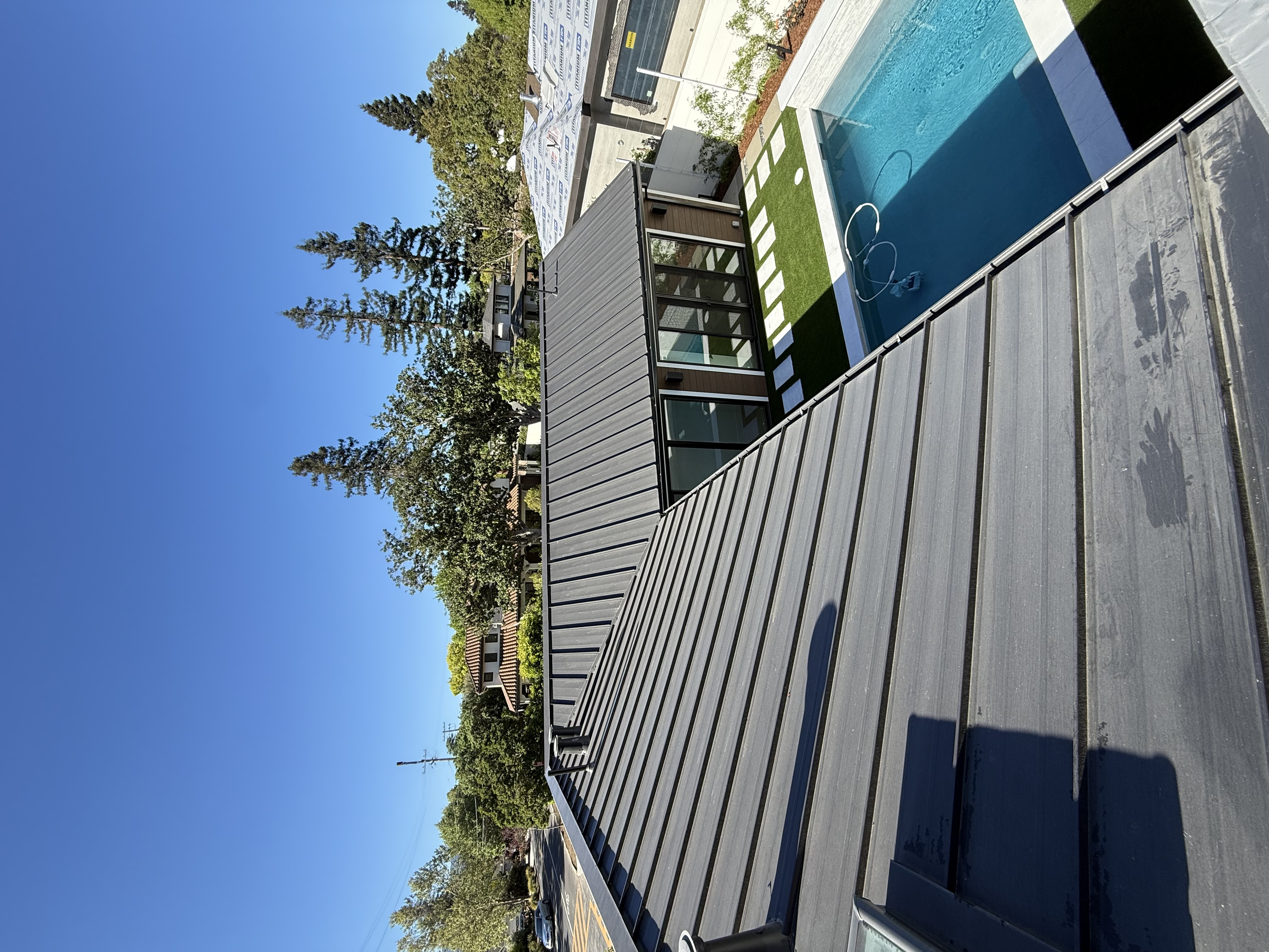 Before — Menlo Park roof with moss and solar panels with bird droppings before service