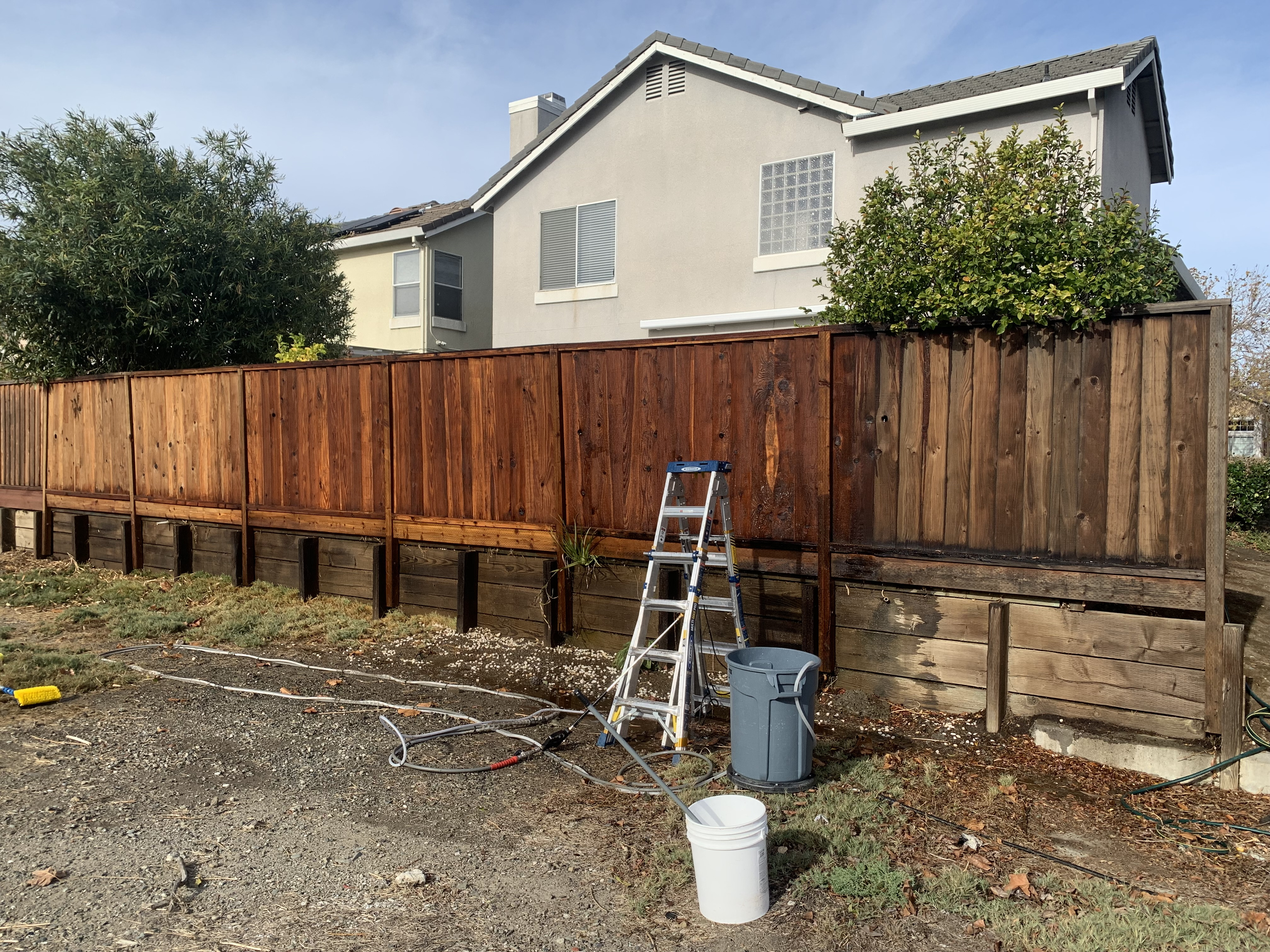 Before — Milpitas fence boards weathered and discolored before cleaning