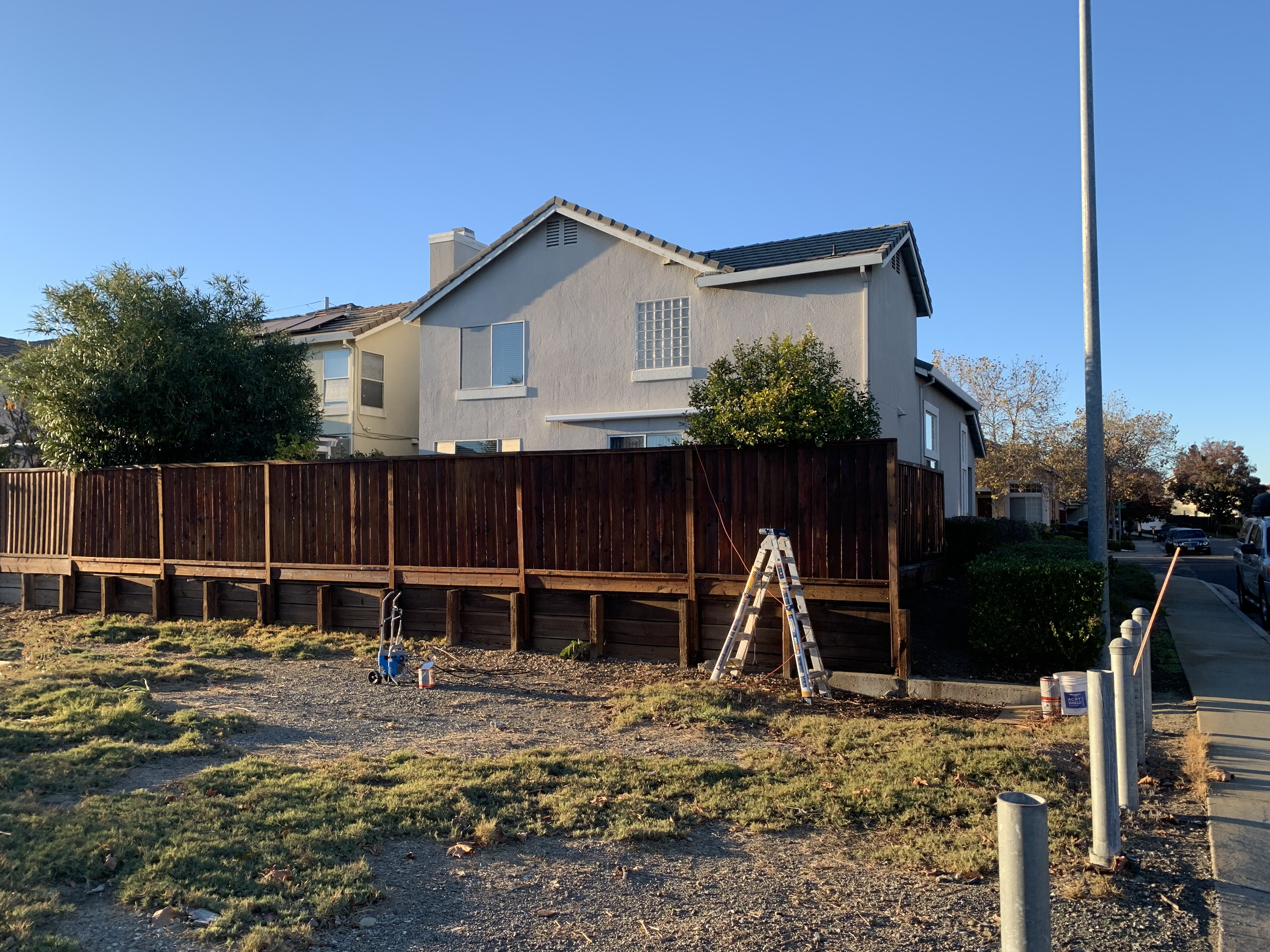 Final — Milpitas fence stained, rich even color across all boards
