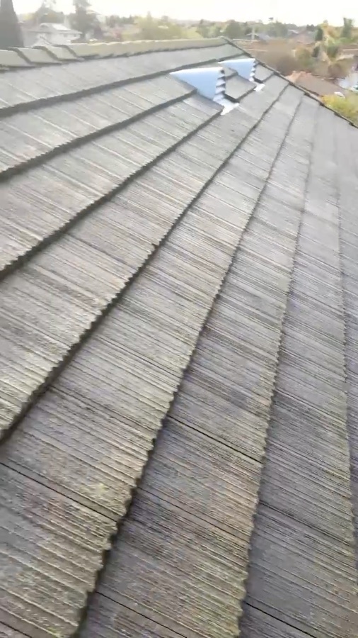 Soft washing a flat concrete tile roof in Milpitas, California