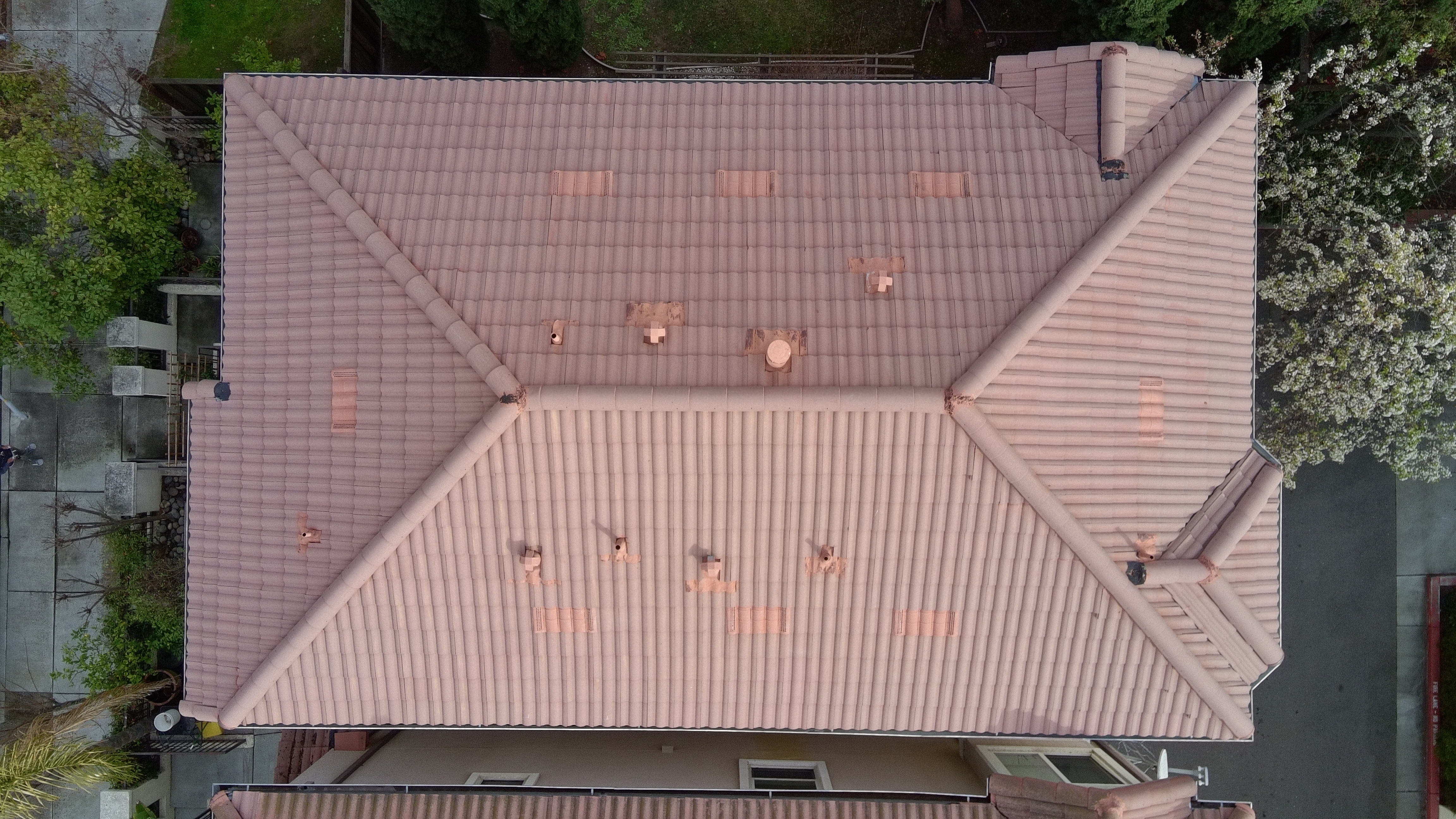 After — San Jose S-tile roof after soft wash, moss cleared from north-facing plane