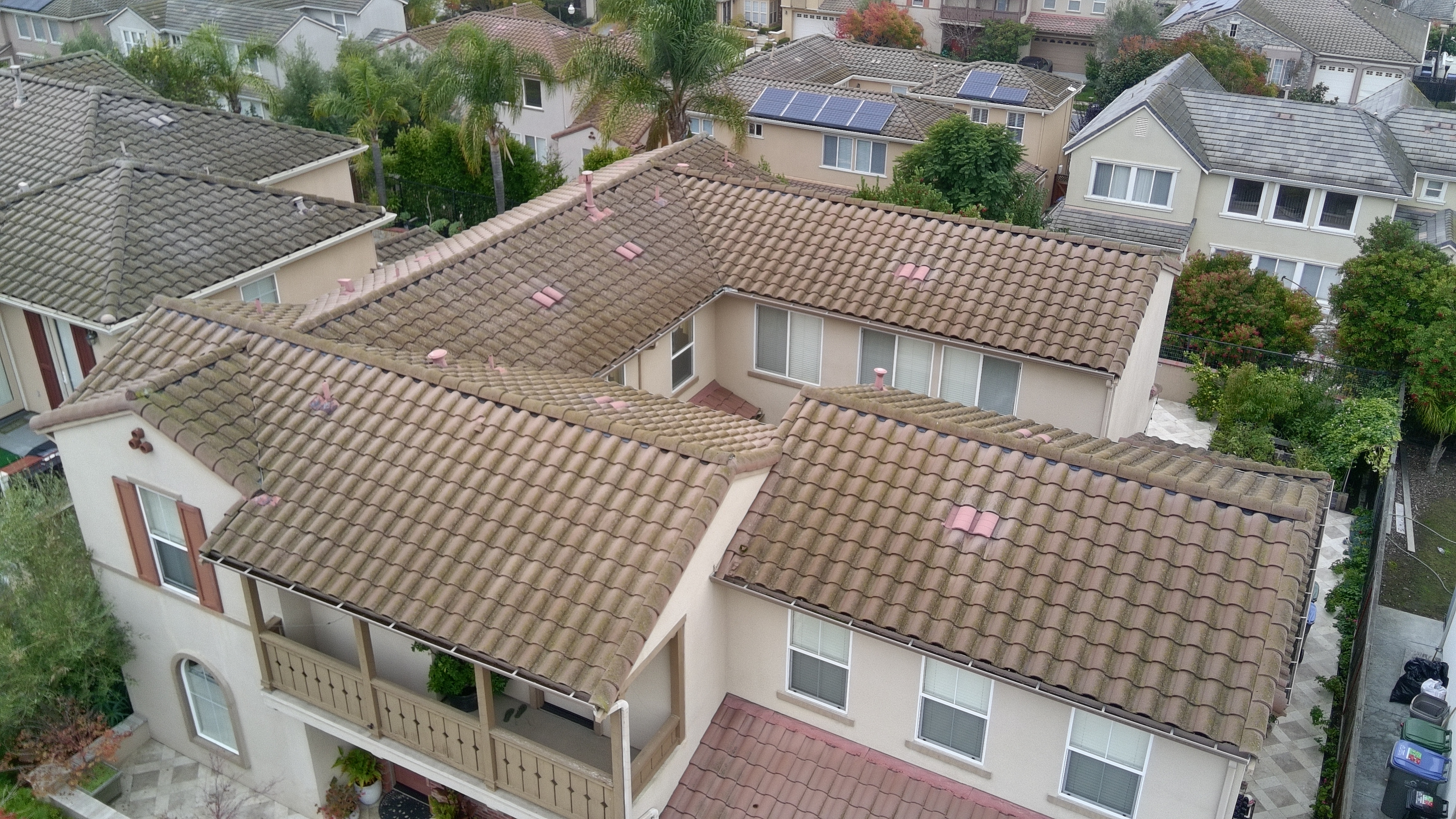 Before — San Jose S-tile roof with dark algae coverage on north-facing plane