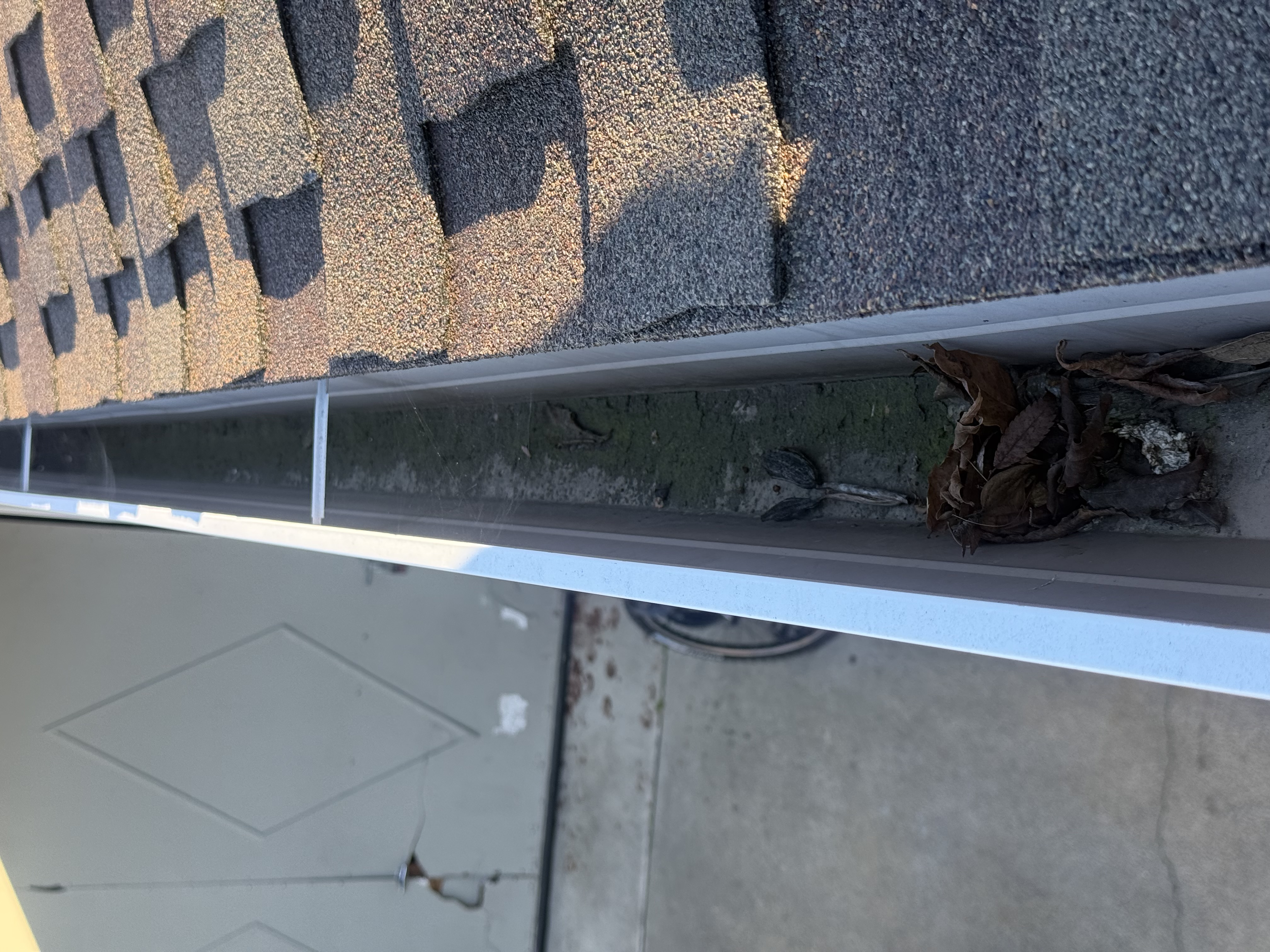 Before — San Jose roof valley with debris accumulation before cleaning