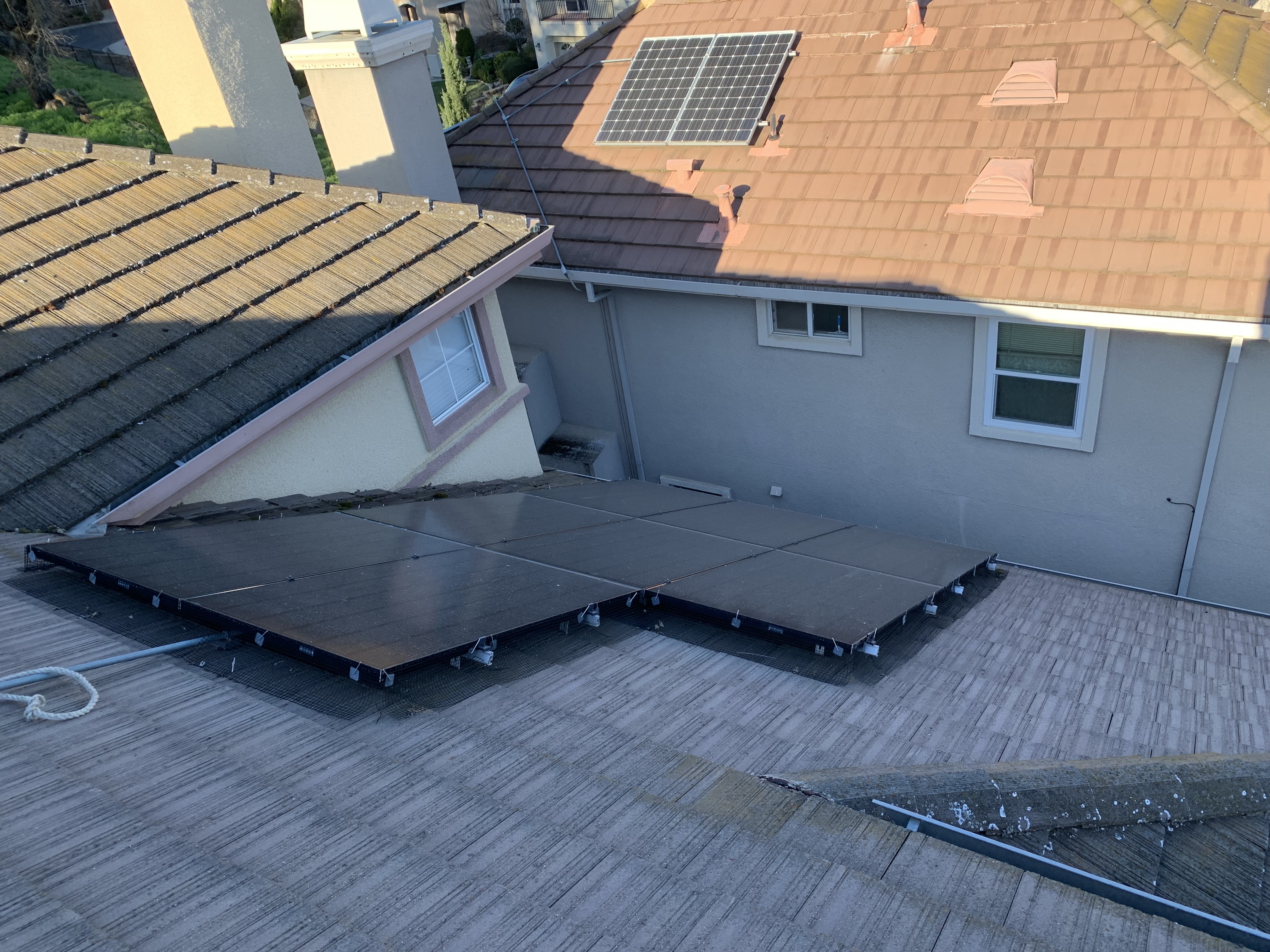 Before — San Jose rooftop solar array with organic film before service