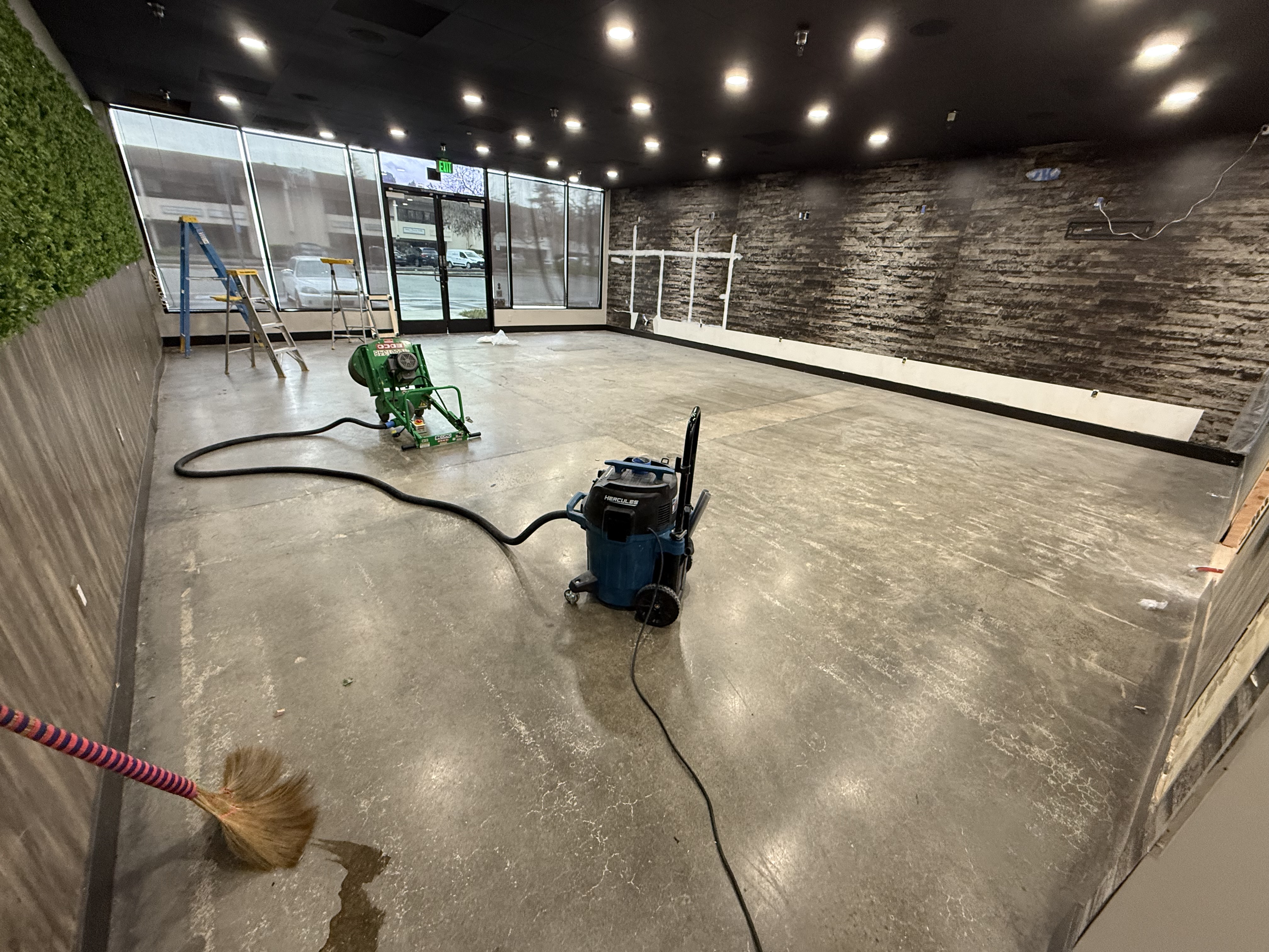 Before — San Jose concrete floor worn and stained before solid color epoxy