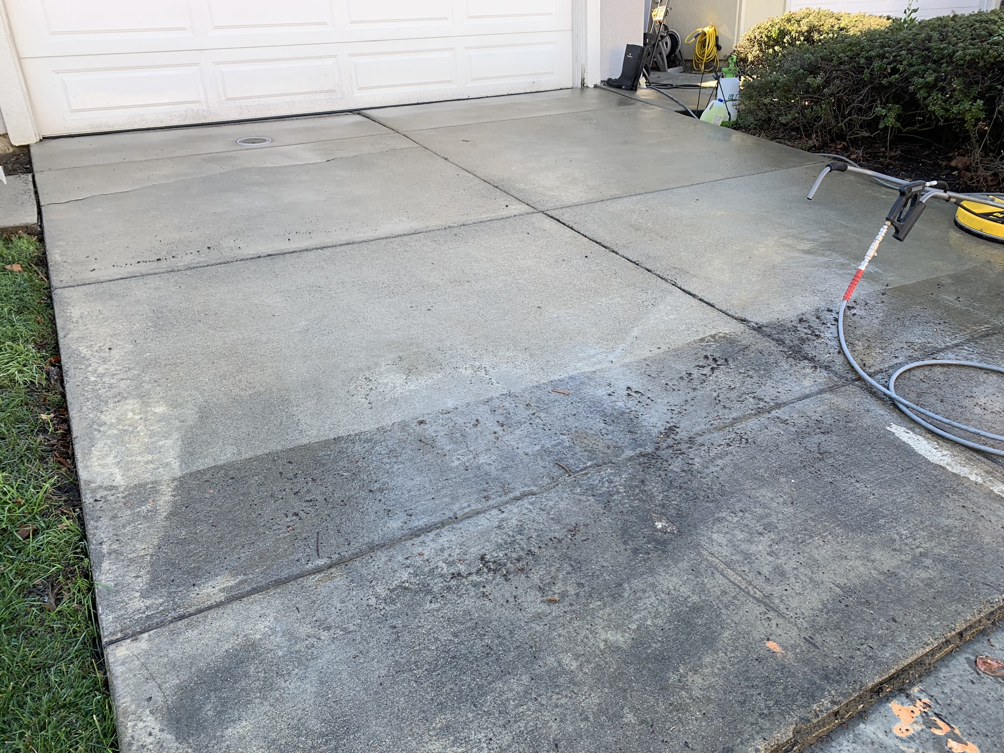 Driveway pressure washing in Milpitas CA — before and after concrete cleaning by Bull Run Exterior Wash LLC